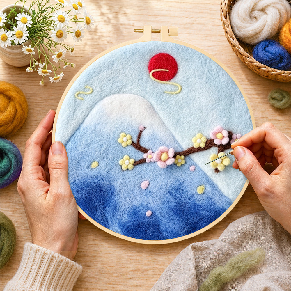 Creating the mount fuji and cherry blossom wool painting by hand with a felting needle