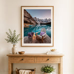 Finished mountain lake retreat cross stitch artwork displayed as home decor