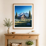 Finished mountain log cabin cross stitch artwork displayed as home decor