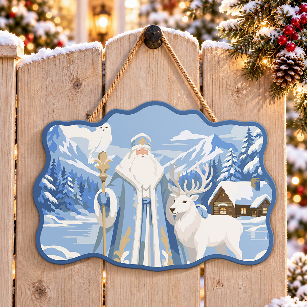 Mountain santa and wildlife paint by numbers door hanger on a garden gate