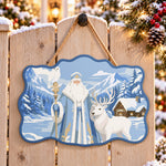 Mountain santa and wildlife paint by numbers door hanger on a garden gate