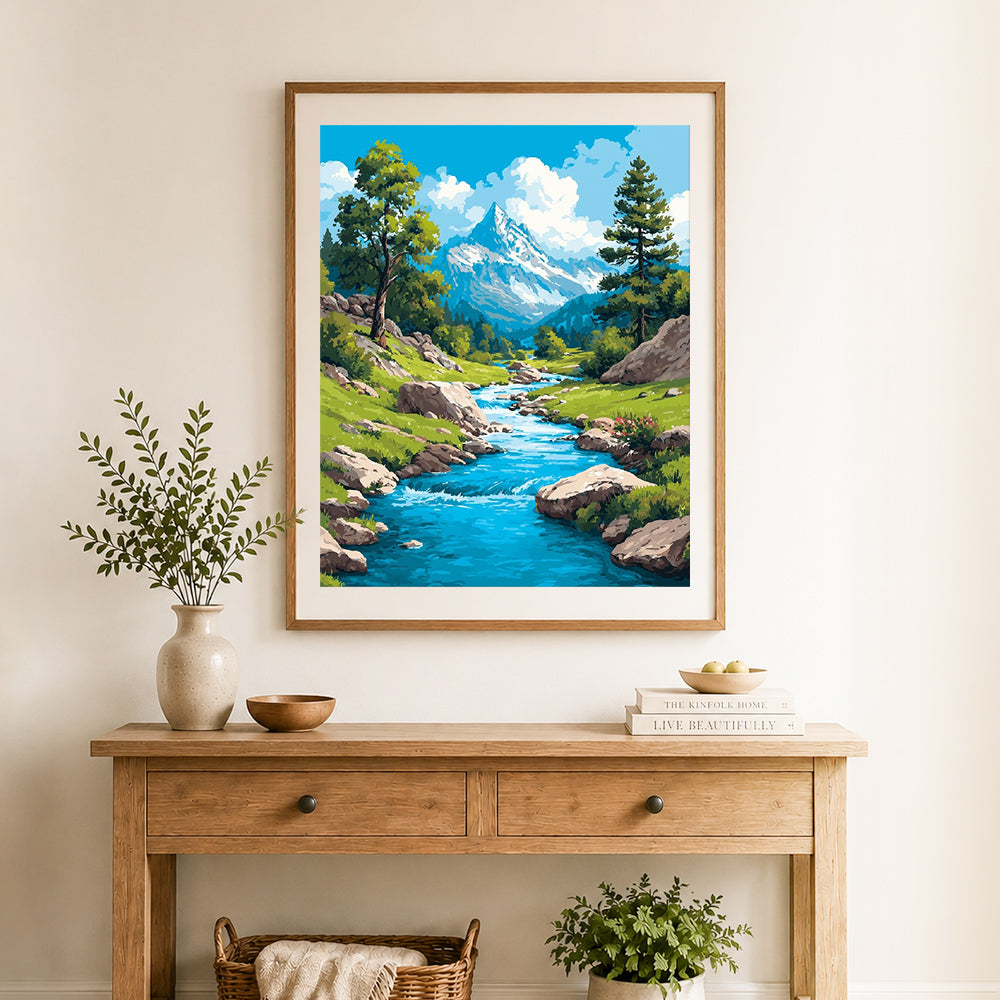 Finished mountain stream valley cross stitch artwork displayed as home decor