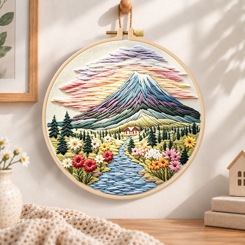 Mountain sunset scenery embroidery hoop wall art displayed as warm and cozy handmade home decor