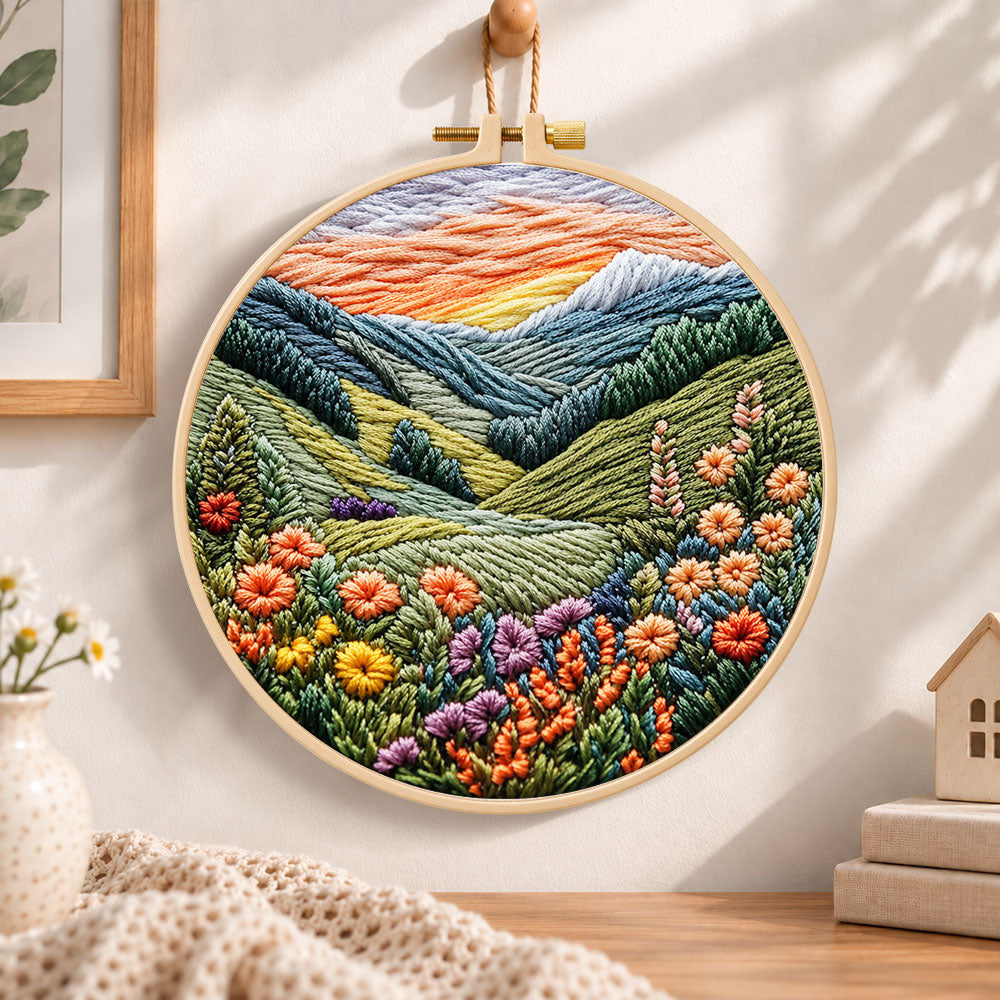 Mountain wildflower valley embroidery hoop wall art displayed as warm and cozy handmade home decor
