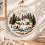 Mountain winter camp embroidery hoop wall art displayed as warm and cozy handmade home decor