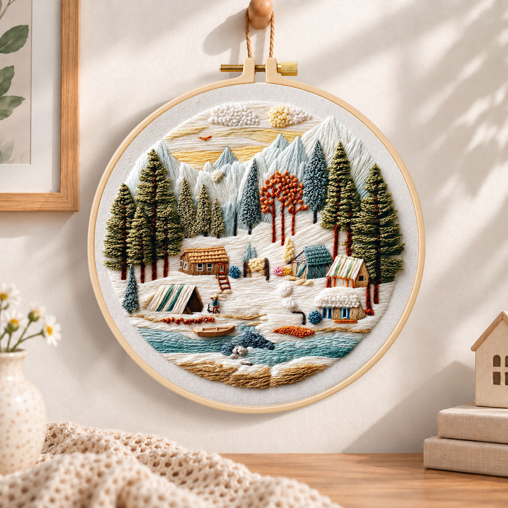 Mountain winter camp embroidery hoop wall art displayed as warm and cozy handmade home decor