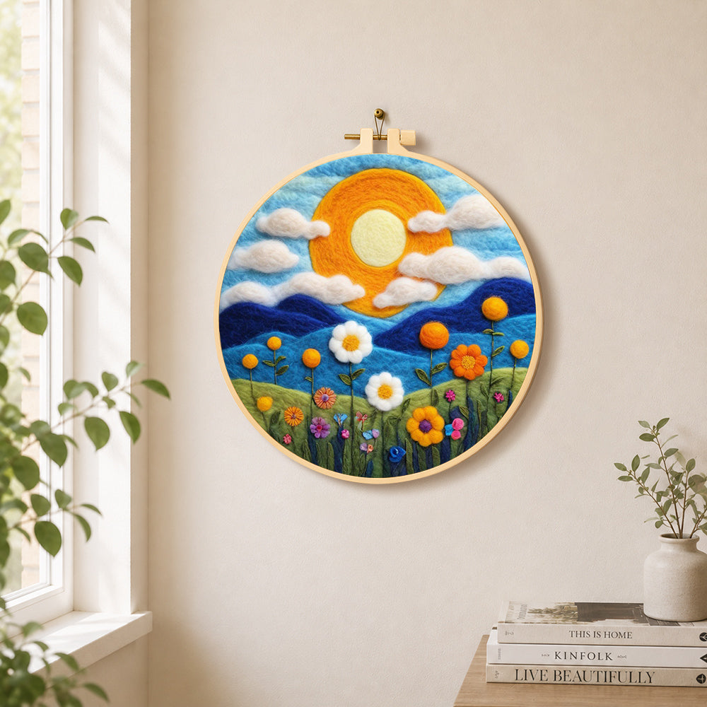 Mountains and wildflowers at sunset needle felt wall art displayed in a bright home interior