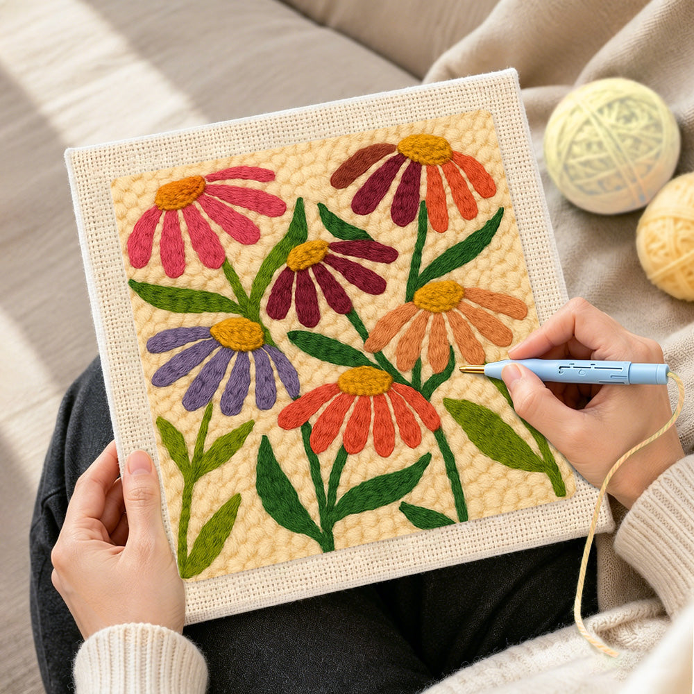 Creating handmade multicolor daisies punch needle artwork