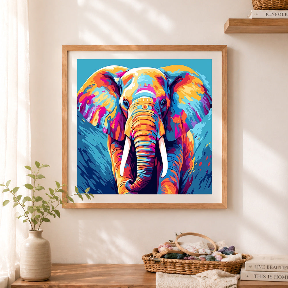 Finished multicolor elephant in blue tone cross stitch artwork displayed as home decor