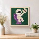 Finished mummy on the toilet artwork displayed on a wall