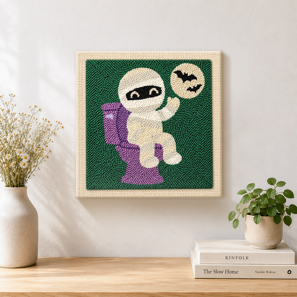 Finished mummy on the toilet artwork displayed on a wall