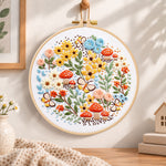 Mushroom and butterfly garden embroidery hoop wall art displayed as warm and cozy handmade home decor
