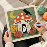 Creating handmade mushroom fairy house with little ghost punch needle artwork