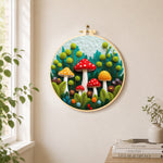 Mushroom group in forest needle felt wall art displayed in a bright home interior