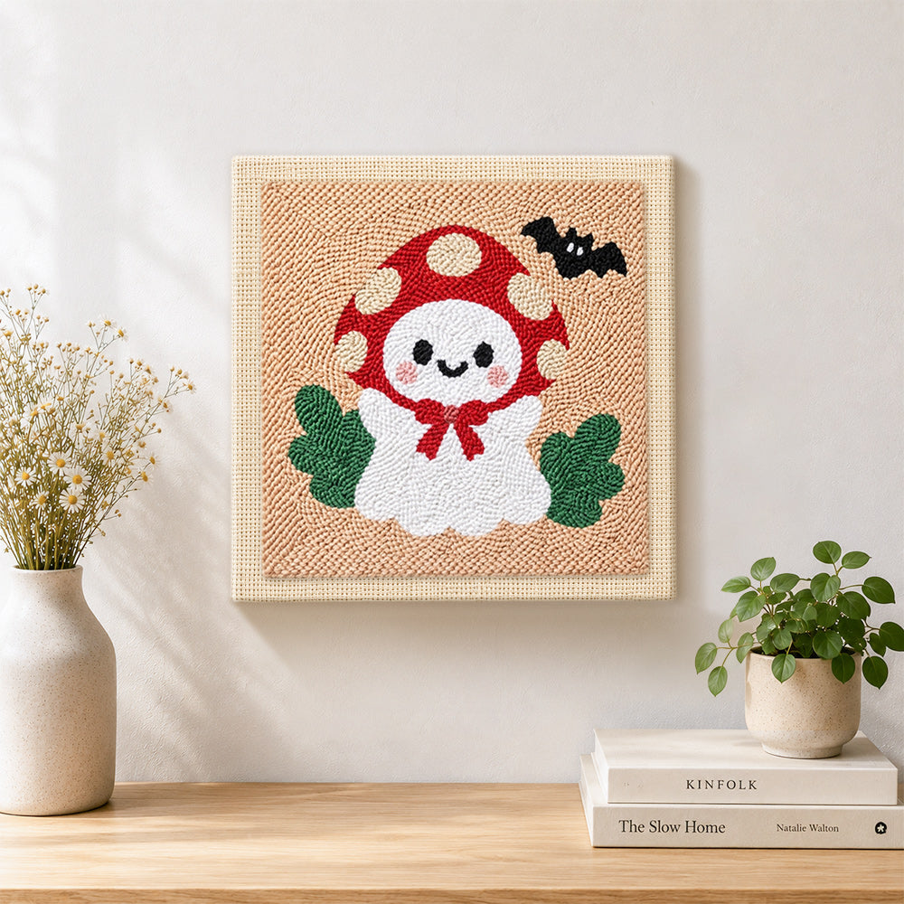 Finished mushroom hat little ghost artwork displayed on a wall