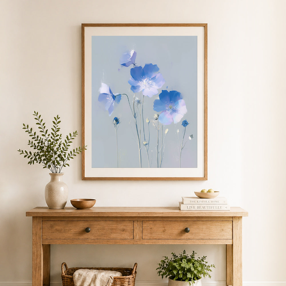 Finished muted blue poppies cross stitch artwork displayed as home decor