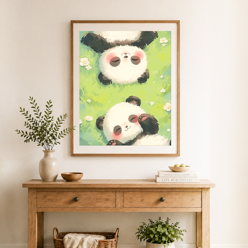 Finished napping baby pandas cross stitch artwork displayed as home decor