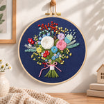 Navy floral bouquet embroidery hoop wall art displayed as warm and cozy handmade home decor
