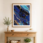 Finished navy gold marble cross stitch artwork displayed as home decor