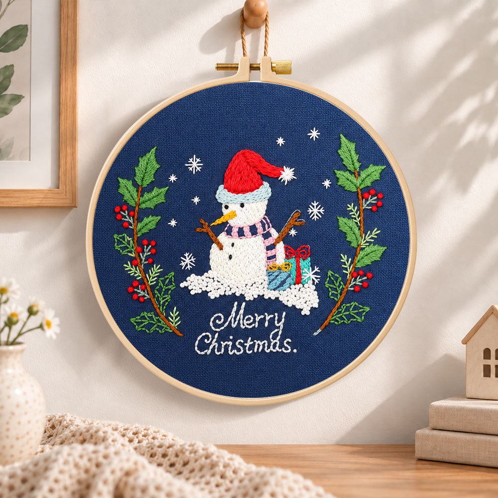 Navy snowman art embroidery hoop wall art displayed as warm and cozy handmade home decor