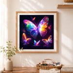 Finished neon glow butterflies cross stitch artwork displayed as home decor