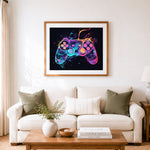 Finished neon glowing game controller cross stitch artwork displayed as home decor