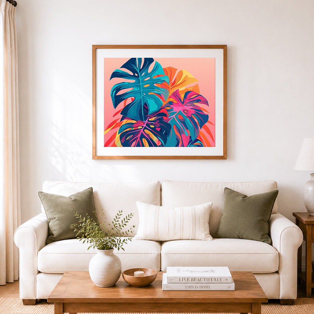 Finished neon tropical monstera leaves cross stitch artwork displayed as home decor