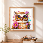 Finished nerdy owl with pink glasses cross stitch artwork displayed as home decor