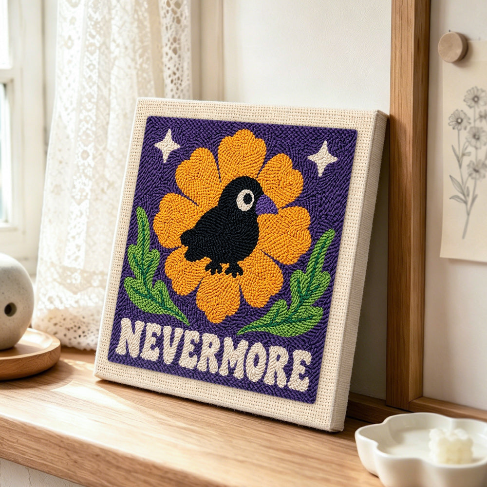 Nevermore raven floral punch needle artwork displayed on a table