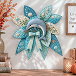 Ocean dolphin quilted bow displayed as handmade wall decor in a cozy home