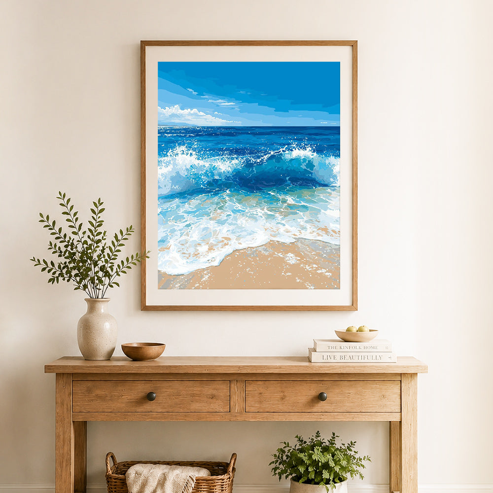 Finished ocean wave splash cross stitch artwork displayed as home decor