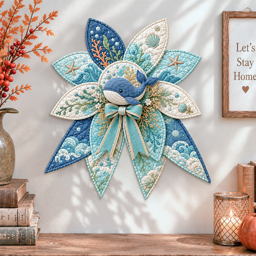 Ocean whale quilted bow displayed as handmade wall decor in a cozy home