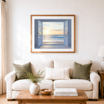 Finished open white doors to a peaceful beach sunrise cross stitch artwork displayed as home decor