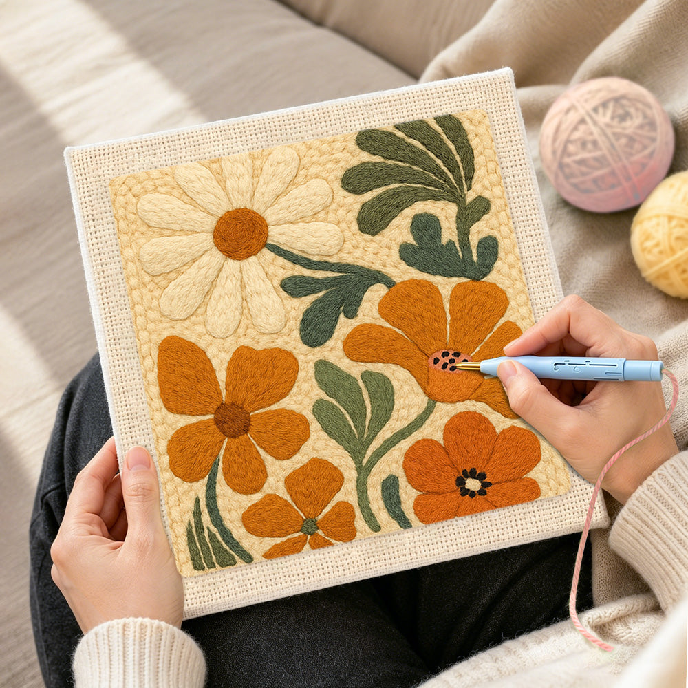 Creating handmade orange and cream flowers punch needle artwork