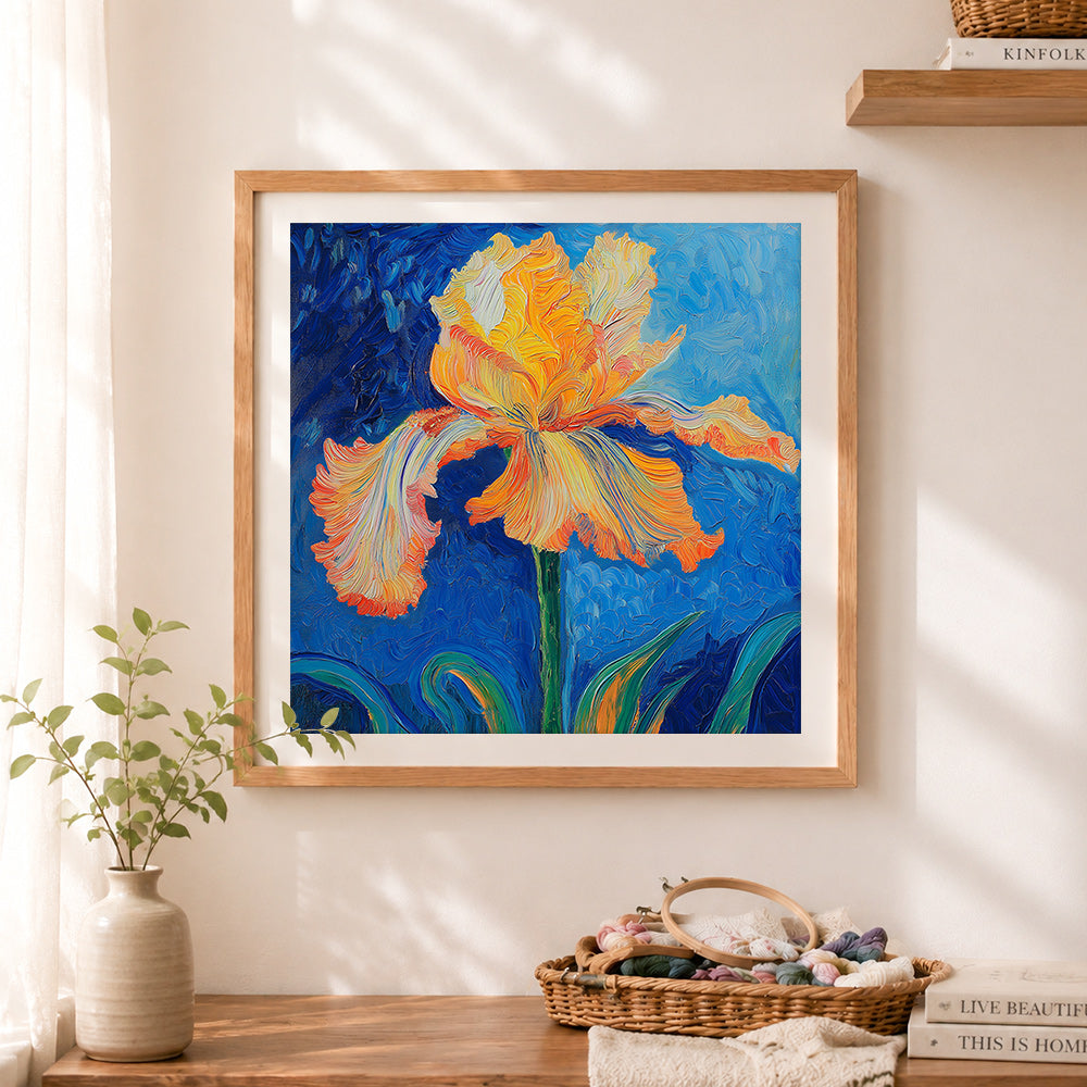 Finished orange and yellow iris cross stitch artwork displayed as home decor