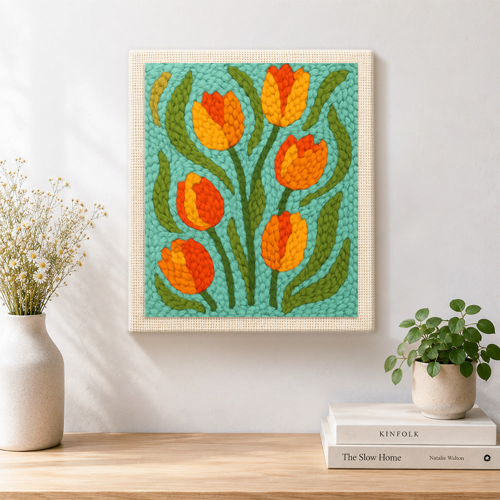 Finished orange and yellow tulip flowers artwork displayed on a wall