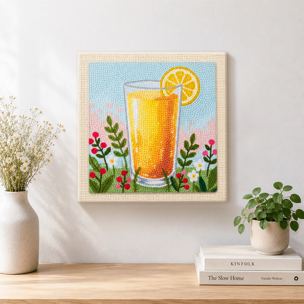 Finished orange juice and some wildflowers artwork displayed on a wall