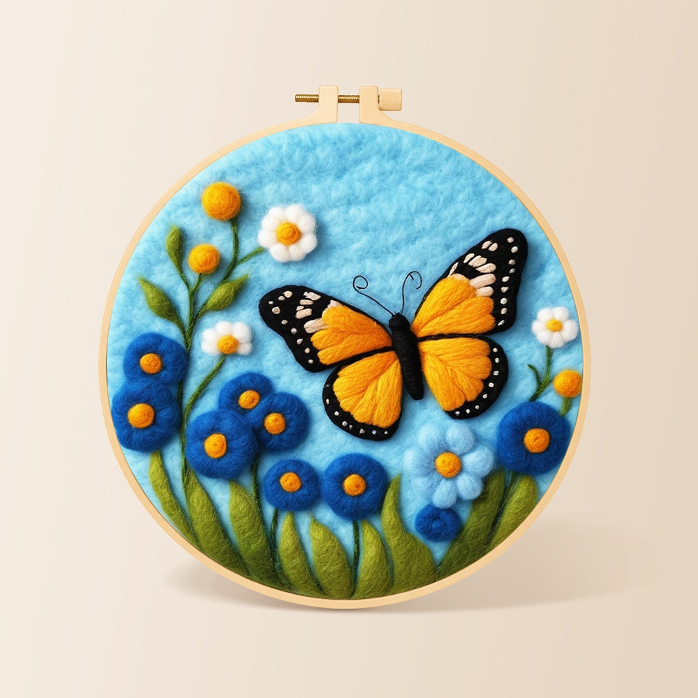 Orange monarch butterfly and blue flowers needle felting kit for beginners with a round wooden frame