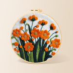Orange-red flower cluster needle felting kit for beginners with a round wooden frame