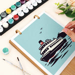 Close-up of painting a passenger boat on the On the Move desk calendar with numbered paints and brushes