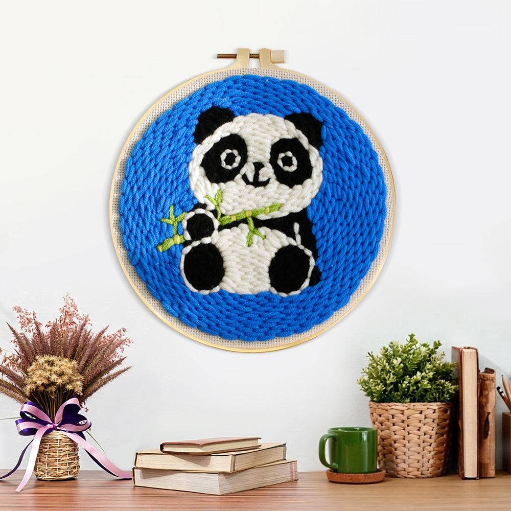 Finished panda with bamboo artwork displayed on a wall