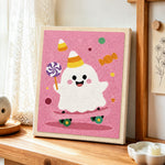 Party ghost with lollipop punch needle artwork displayed on a table