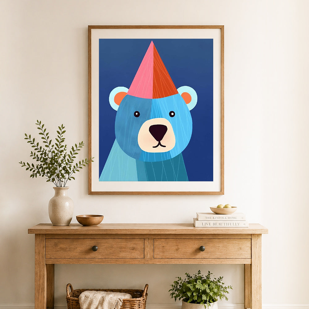 Finished party hat blue bear cross stitch artwork displayed as home decor
