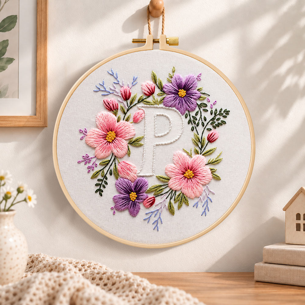 Pastel blossoms and letter p embroidery hoop wall art displayed as warm and cozy handmade home decor