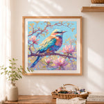 Finished pastel blue bird and magnolia cross stitch artwork displayed as home decor