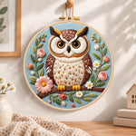 Pastel floral owl embroidery hoop wall art displayed as warm and cozy handmade home decor