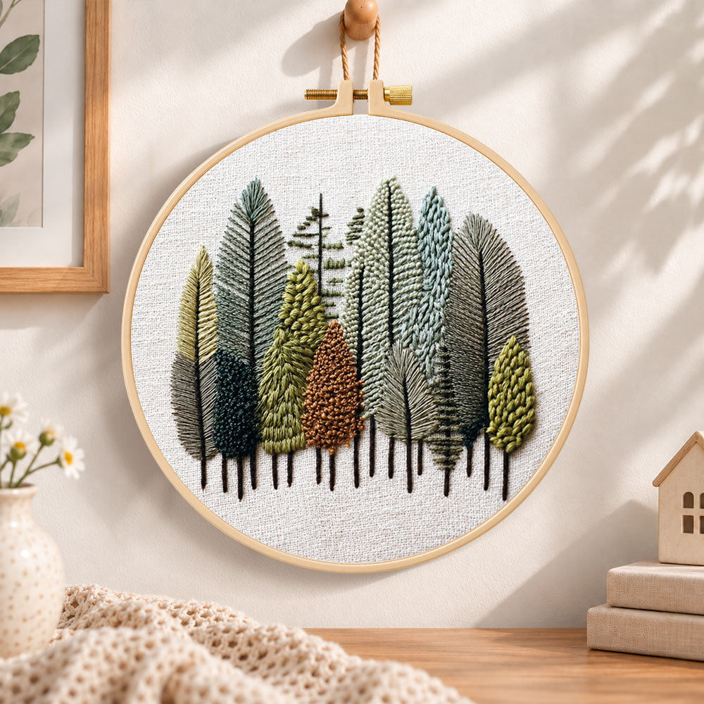 Pastel forest grove embroidery hoop wall art displayed as warm and cozy handmade home decor