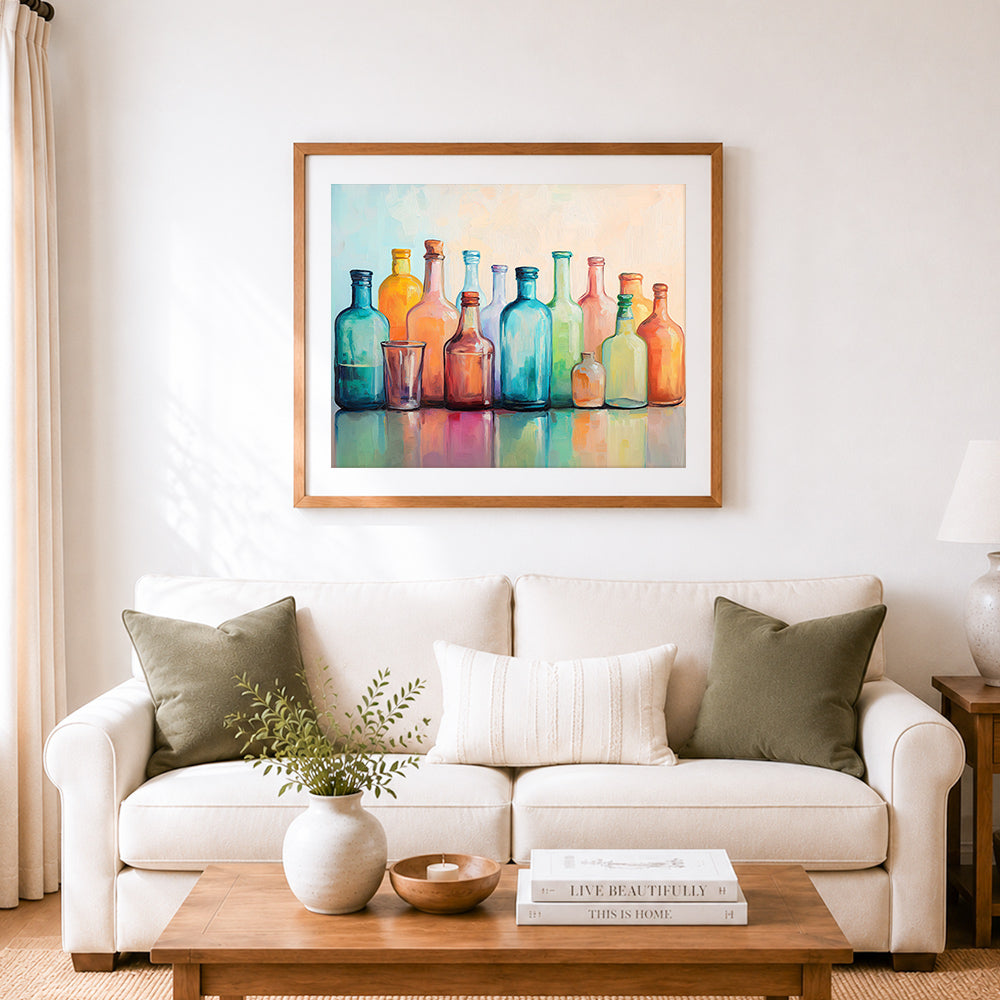 Finished pastel glass bottle glow cross stitch artwork displayed as home decor