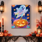 Finished pastel glowing ghost over jack‑o‑lantern pearl diamond painting artwork displayed as holiday home decor