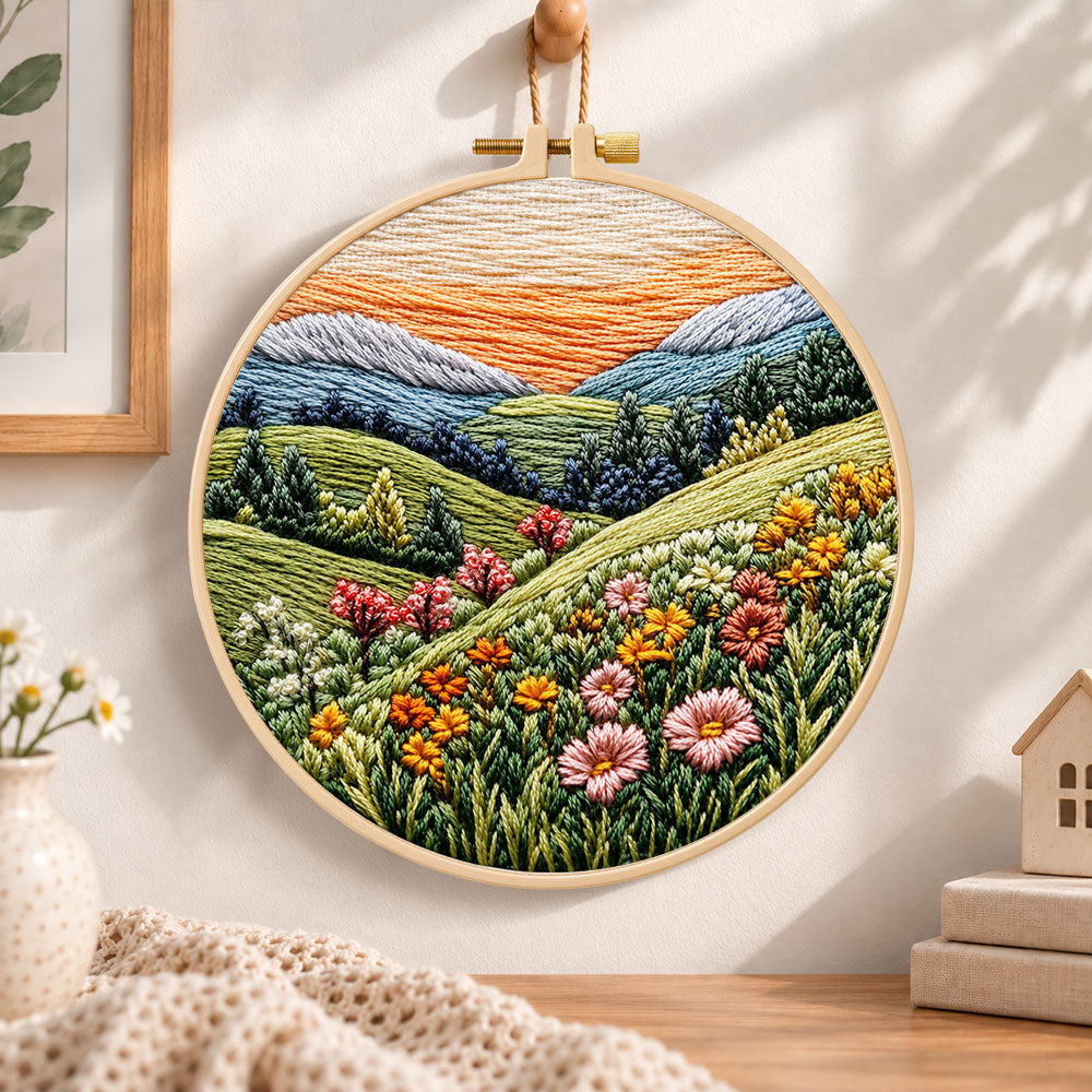 Pastel mountain flower hills embroidery hoop wall art displayed as warm and cozy handmade home decor